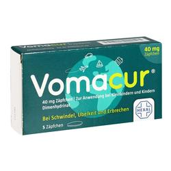 Grüne Verpackung mit der Aufschrift "Vomacur", einem Medikament gegen Übelkeit.